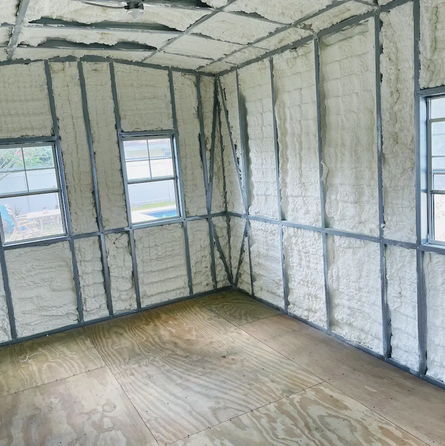 Closed-cell spray foam insulation applied to wall cavities in a residential project in Sabattus